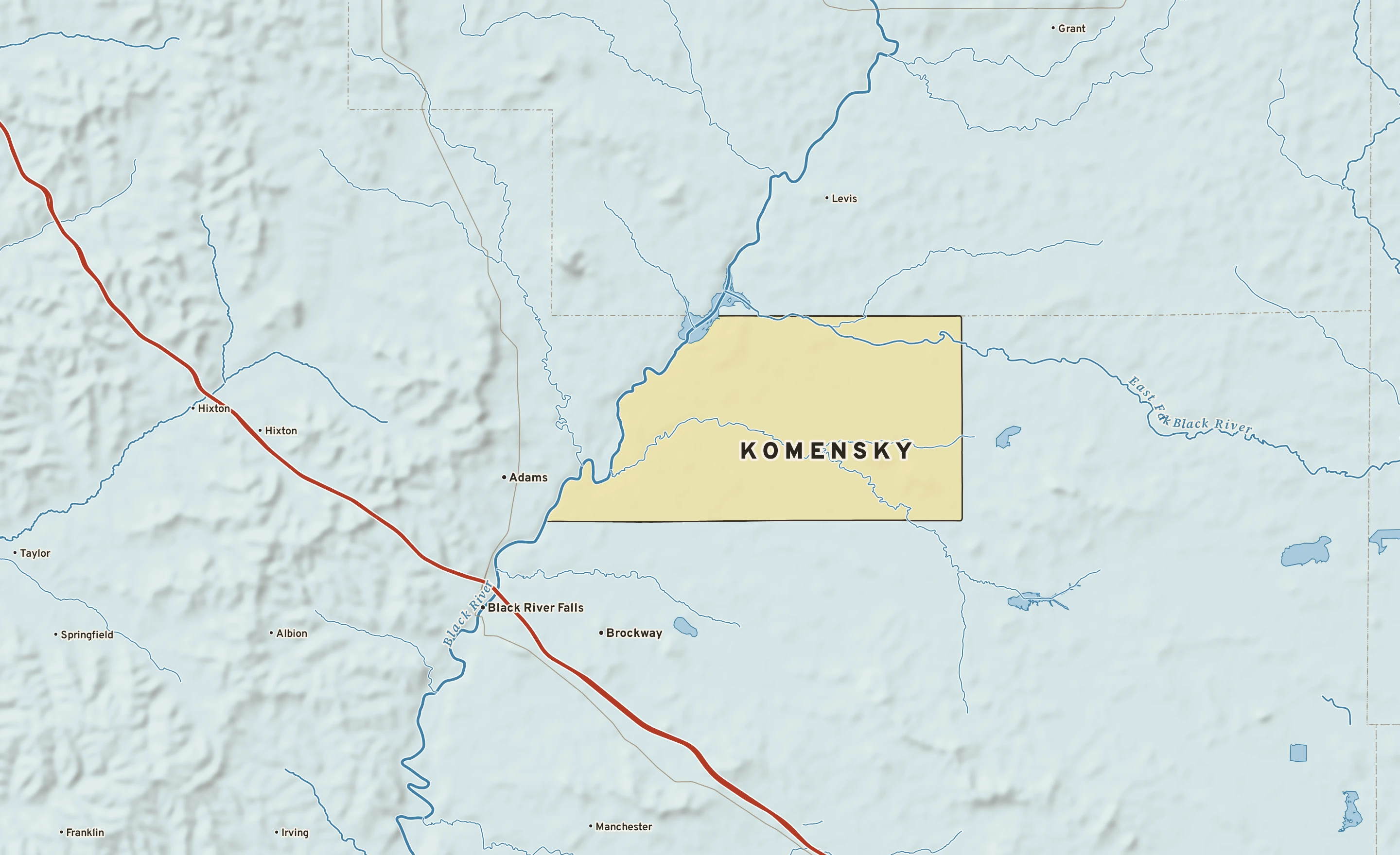 Shaded-relief atlas plate of Komensky, Wisconsin: rivers, roads, the city limits and where the water drains.