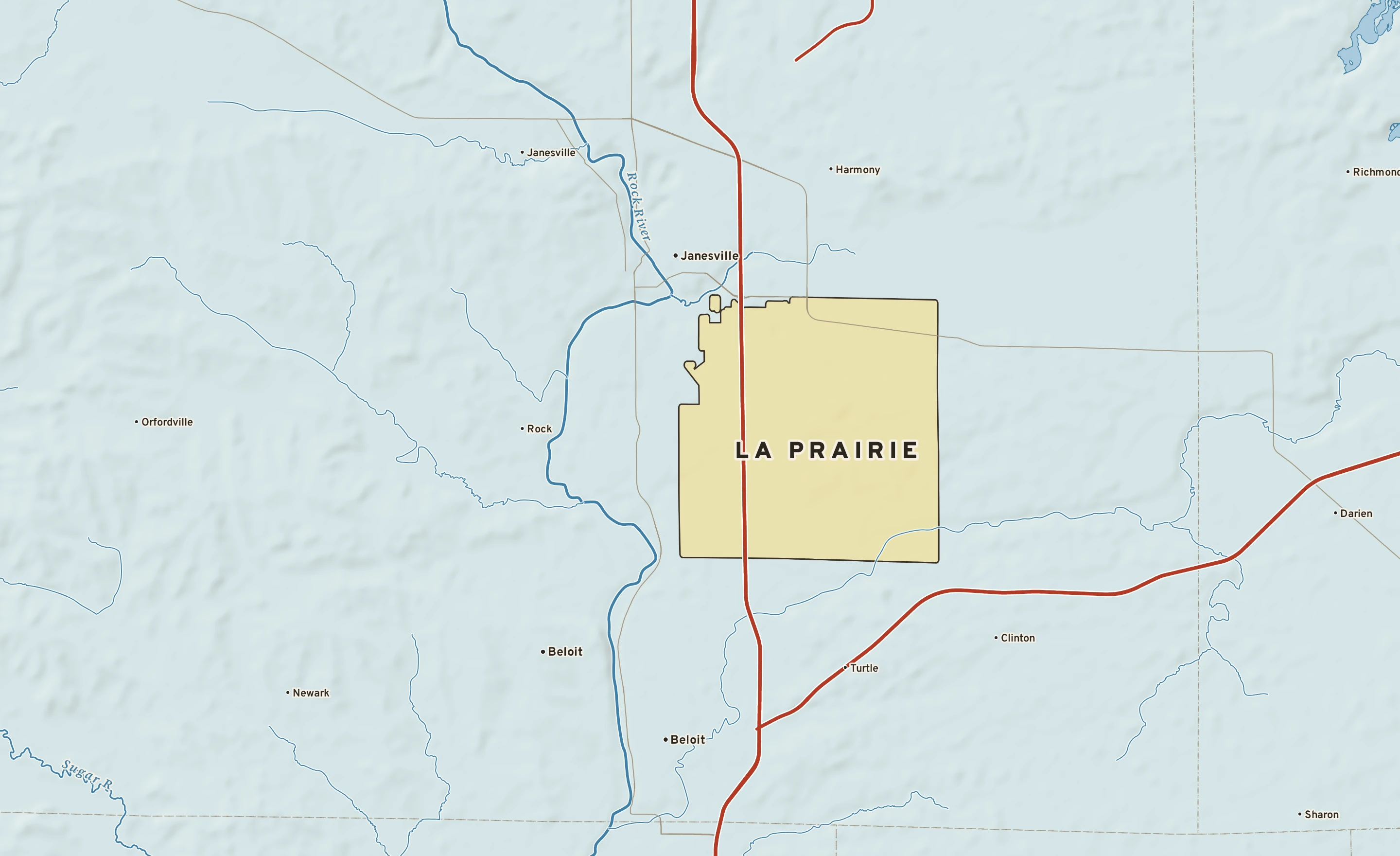 Shaded-relief atlas plate of La Prairie, Wisconsin: rivers, roads, the city limits and where the water drains.