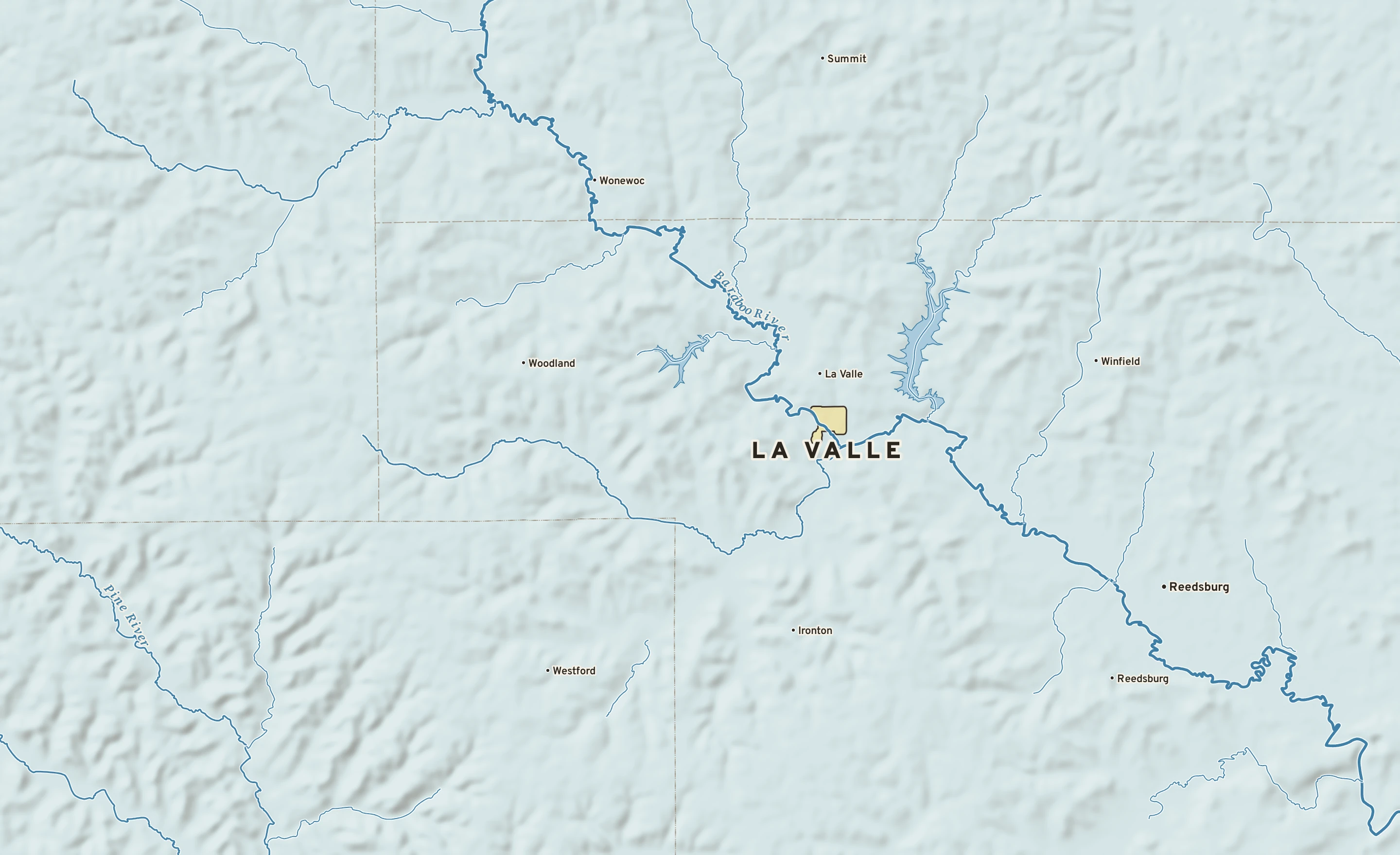 Shaded-relief atlas plate of La Valle, Wisconsin: rivers, roads, the city limits and where the water drains.