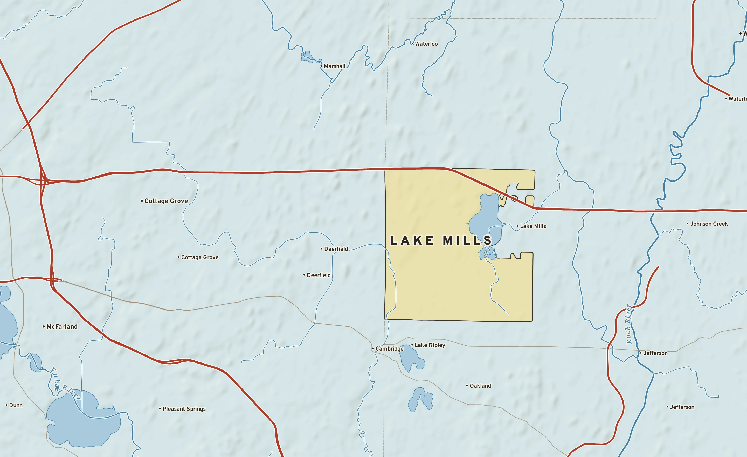 Shaded-relief atlas plate of Lake Mills, Wisconsin: rivers, roads, the city limits and where the water drains.