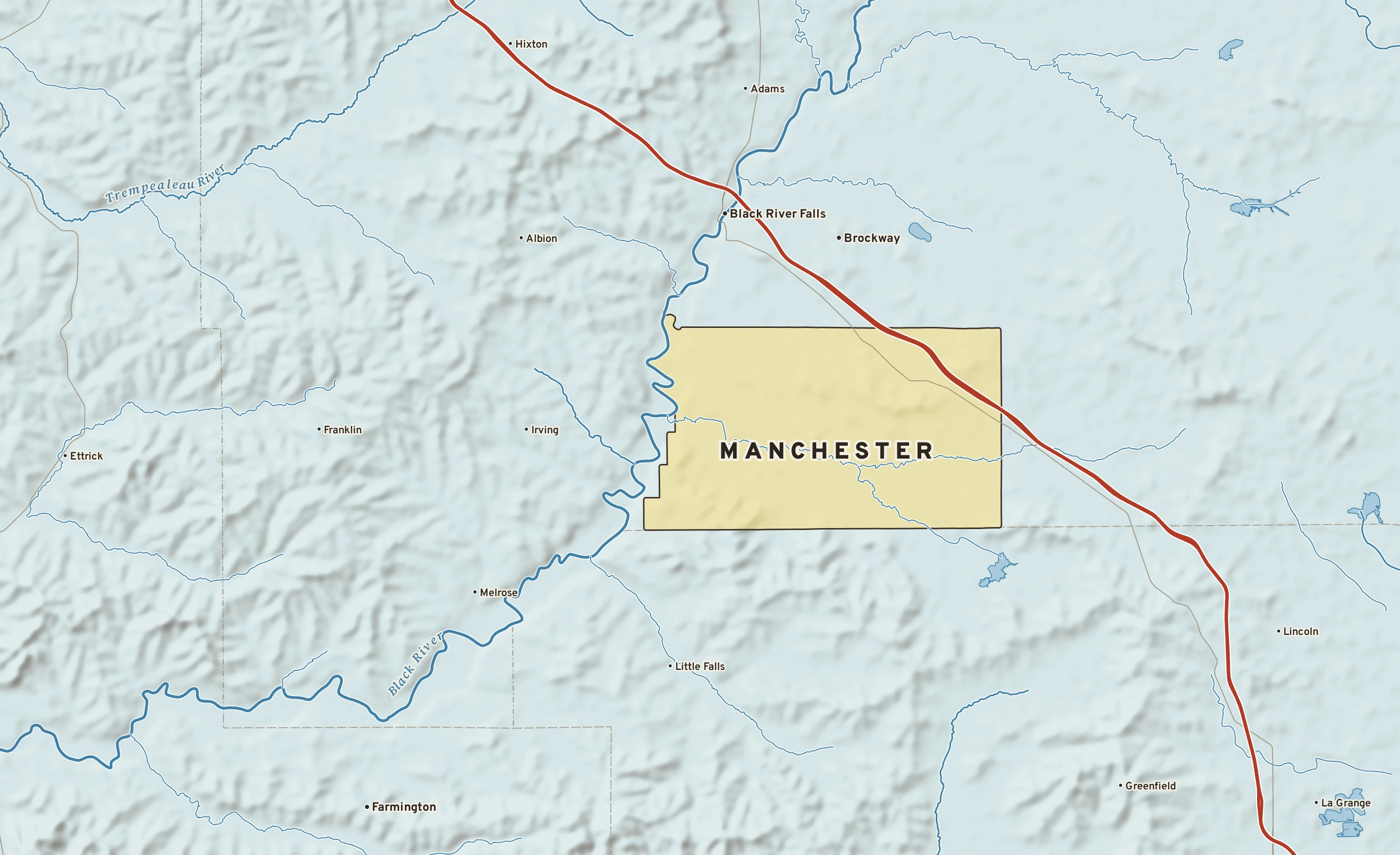 Shaded-relief atlas plate of Manchester, Wisconsin: rivers, roads, the city limits and where the water drains.