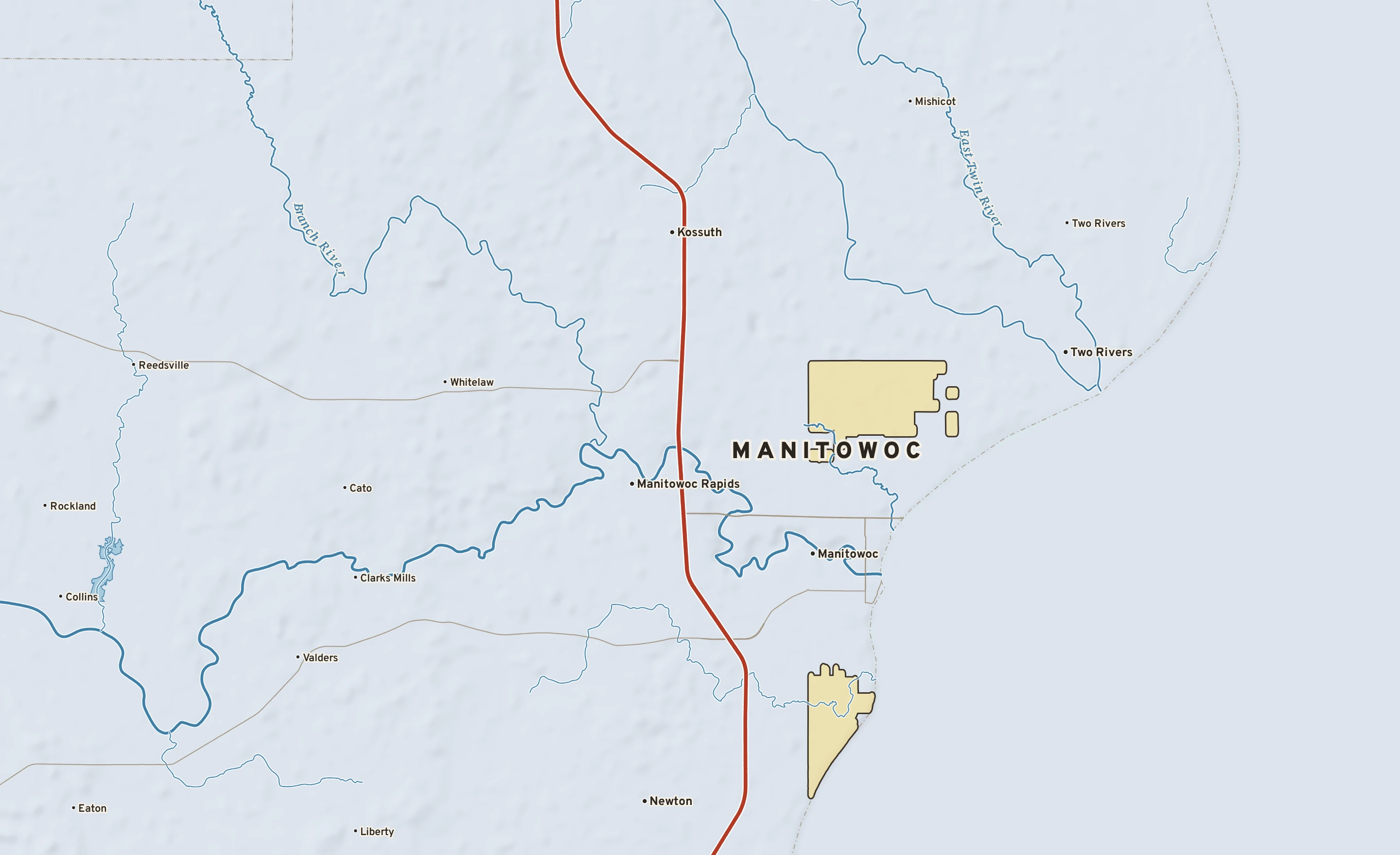 Shaded-relief atlas plate of Manitowoc, Wisconsin: rivers, roads, the city limits and where the water drains.