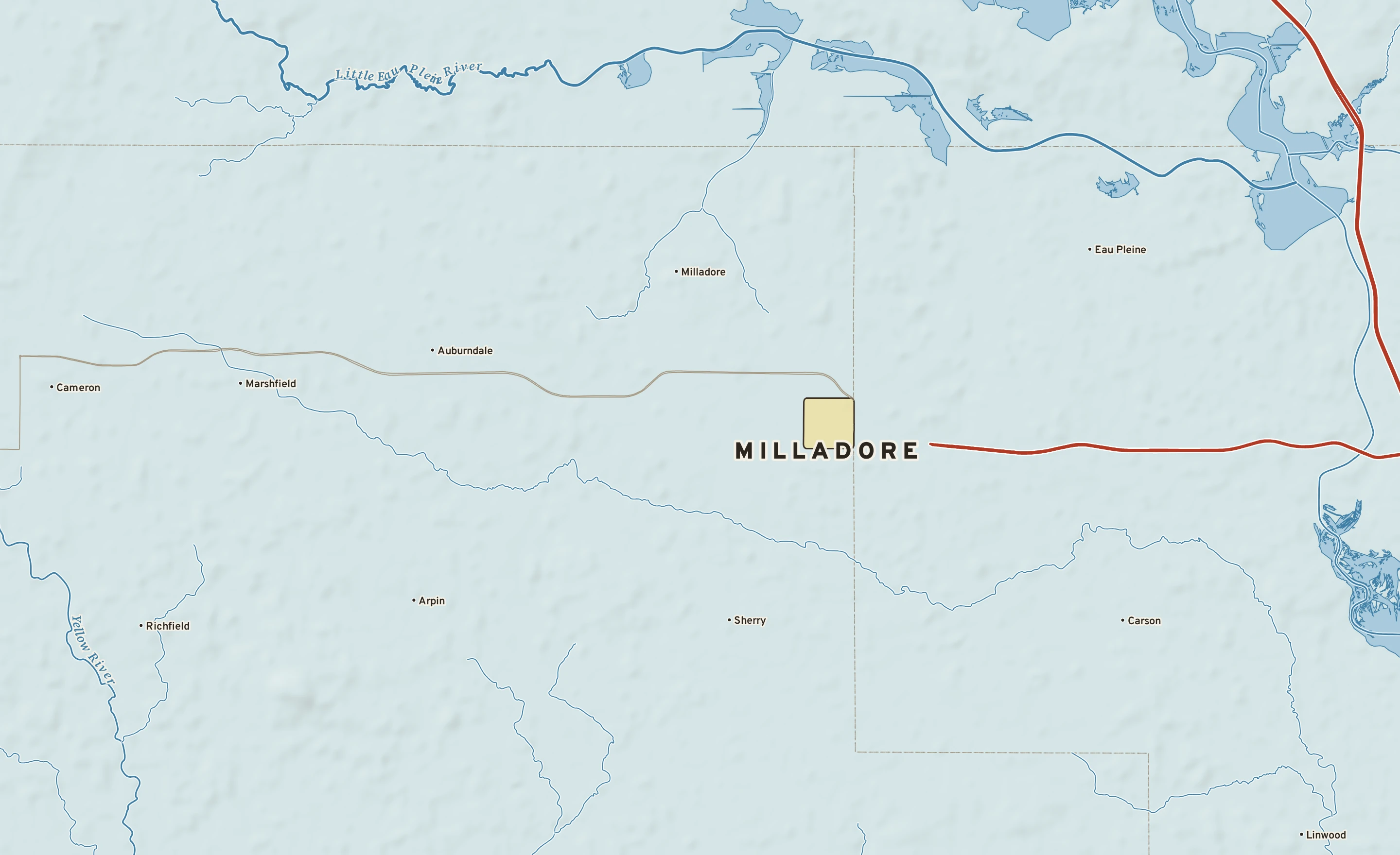 Shaded-relief atlas plate of Milladore, Wisconsin: rivers, roads, the city limits and where the water drains.