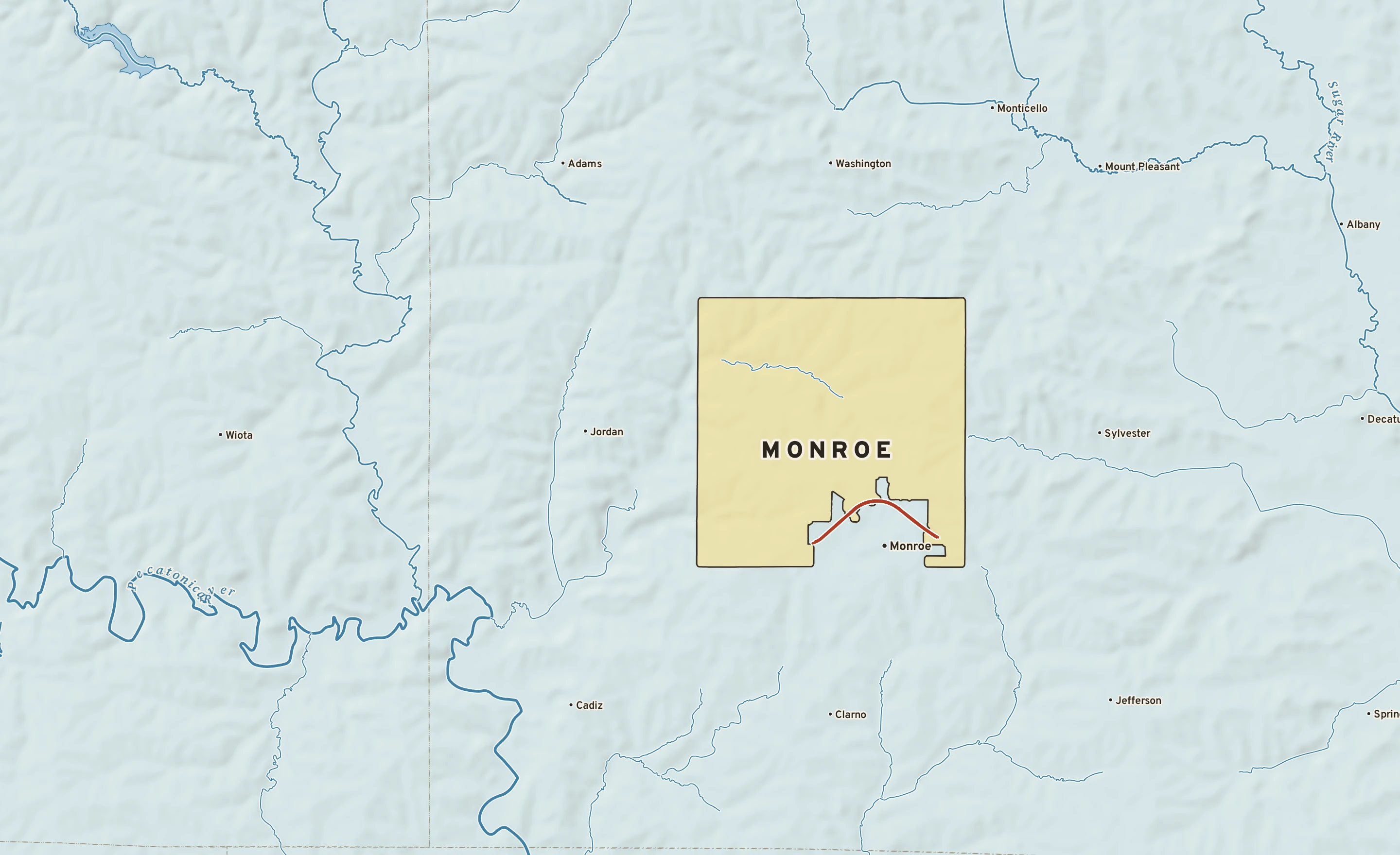 Shaded-relief atlas plate of Monroe, Wisconsin: rivers, roads, the city limits and where the water drains.