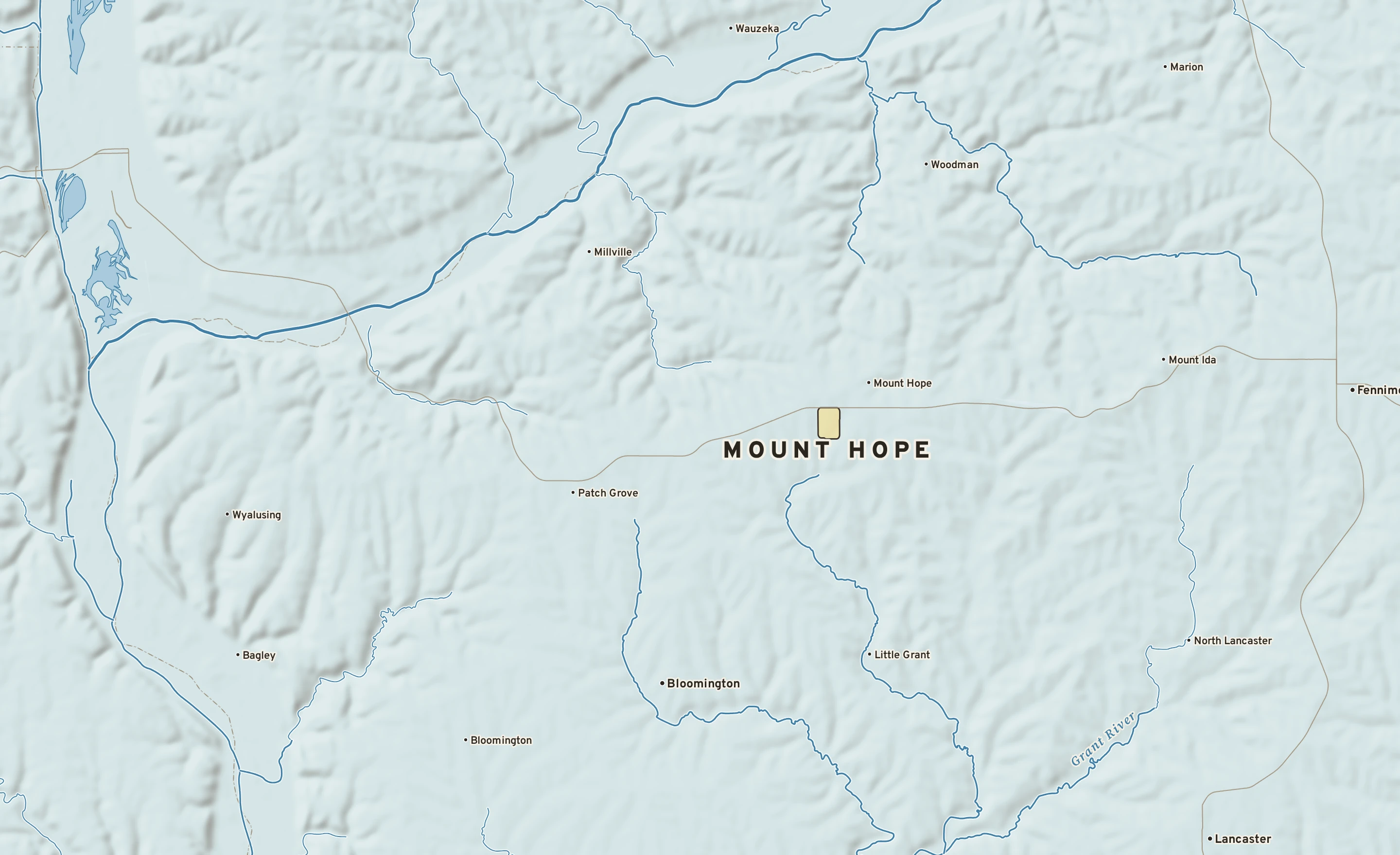 Shaded-relief atlas plate of Mount Hope, Wisconsin: rivers, roads, the city limits and where the water drains.