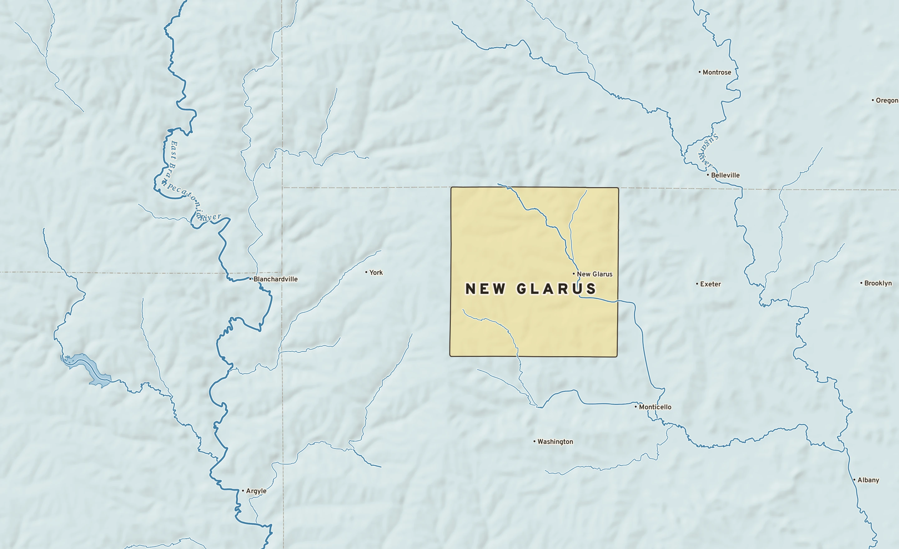 Shaded-relief atlas plate of New Glarus, Wisconsin: rivers, roads, the city limits and where the water drains.
