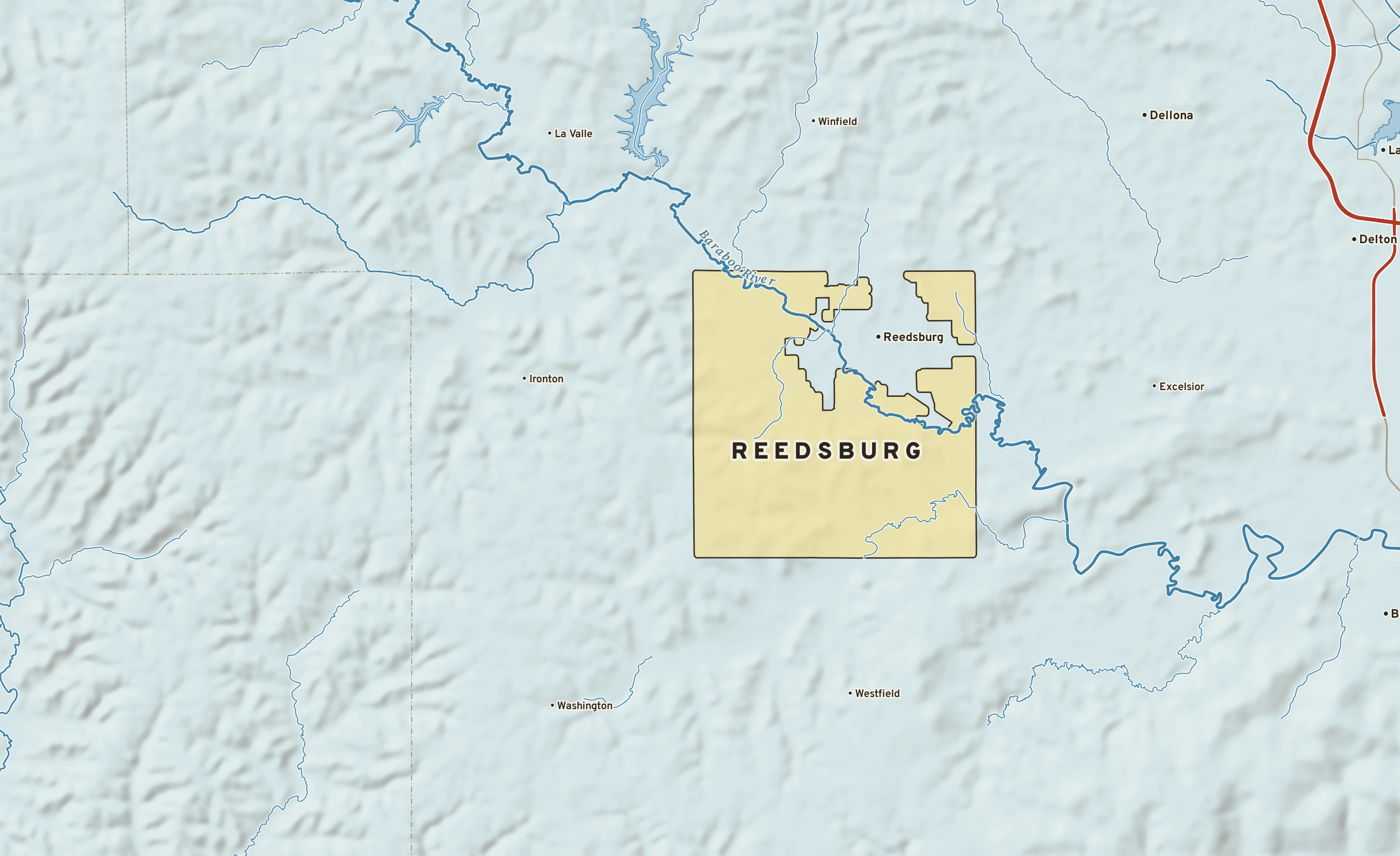 Shaded-relief atlas plate of Reedsburg, Wisconsin: rivers, roads, the city limits and where the water drains.