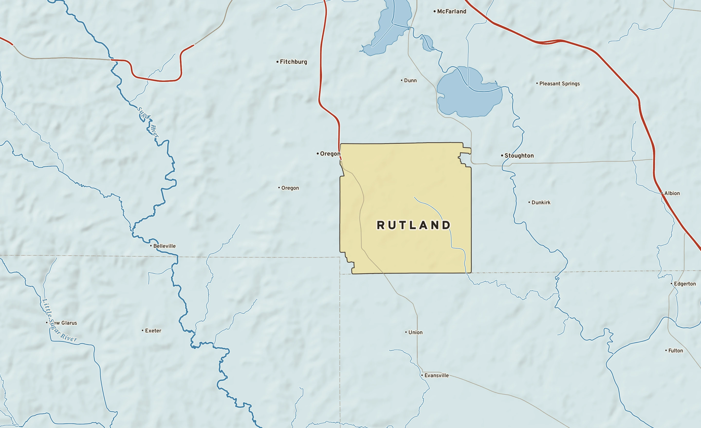 Shaded-relief atlas plate of Rutland, Wisconsin: rivers, roads, the city limits and where the water drains.