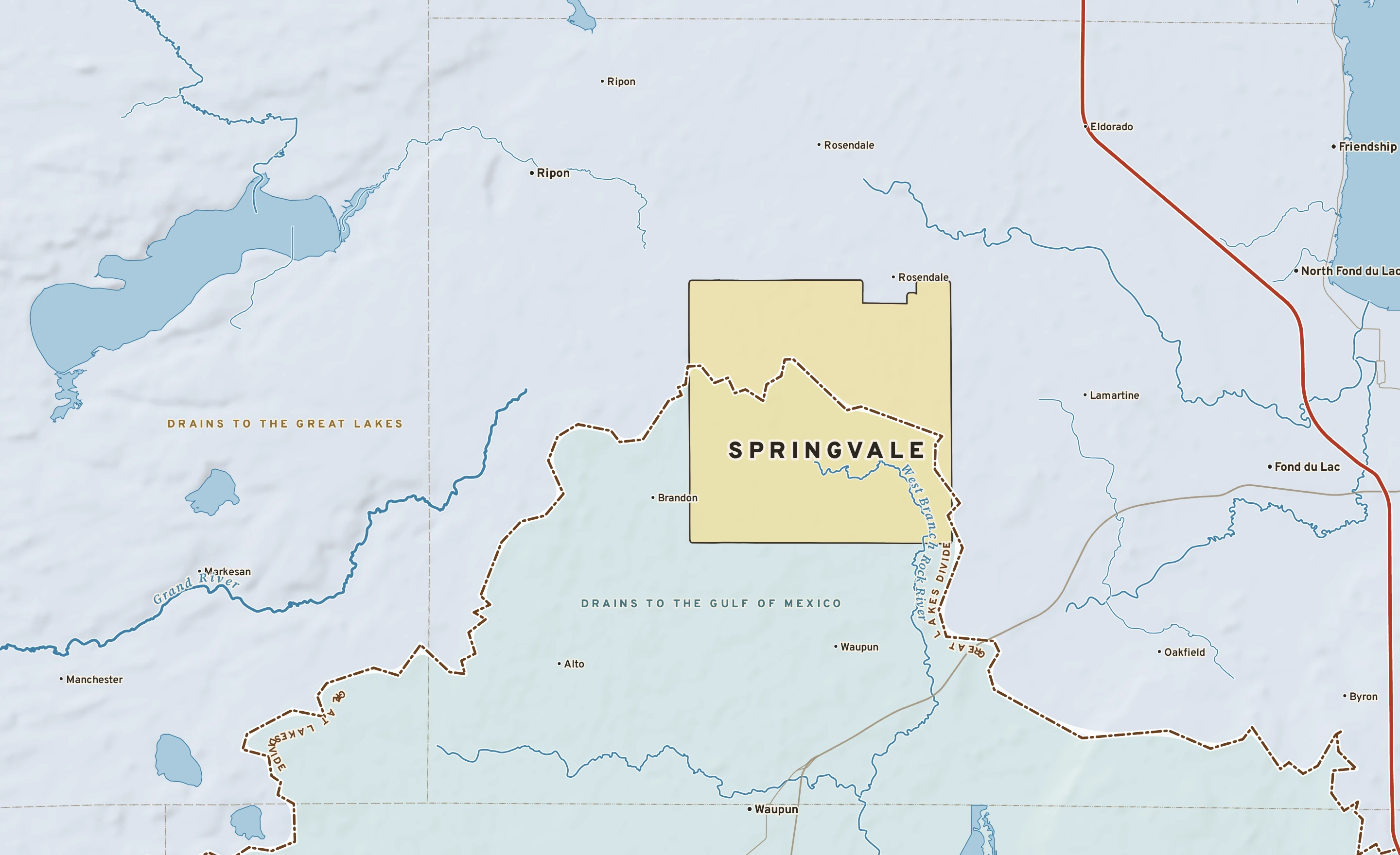 Shaded-relief atlas plate of Springvale, Wisconsin: rivers, roads, the city limits and where the water drains.