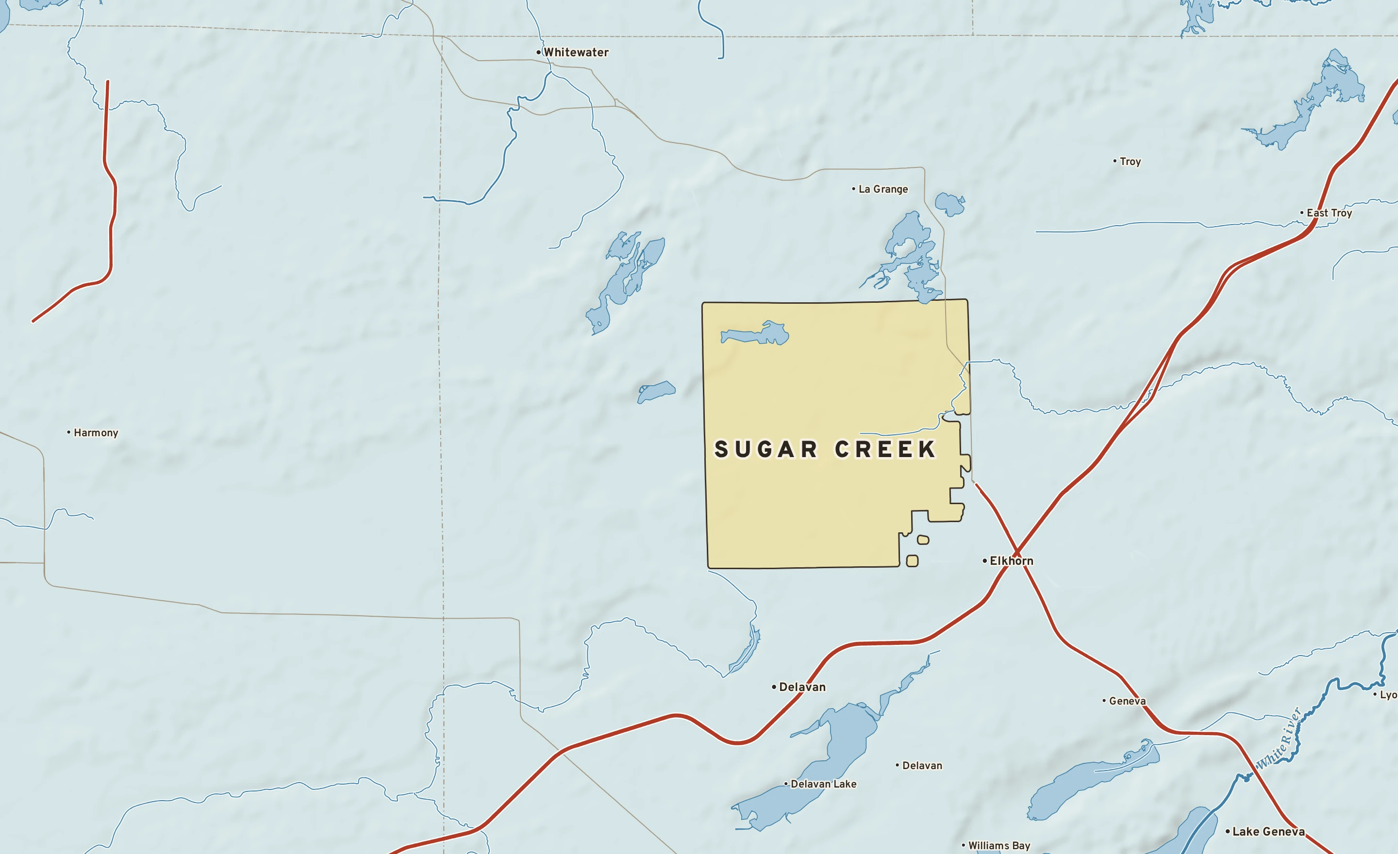Shaded-relief atlas plate of Sugar Creek, Wisconsin: rivers, roads, the city limits and where the water drains.