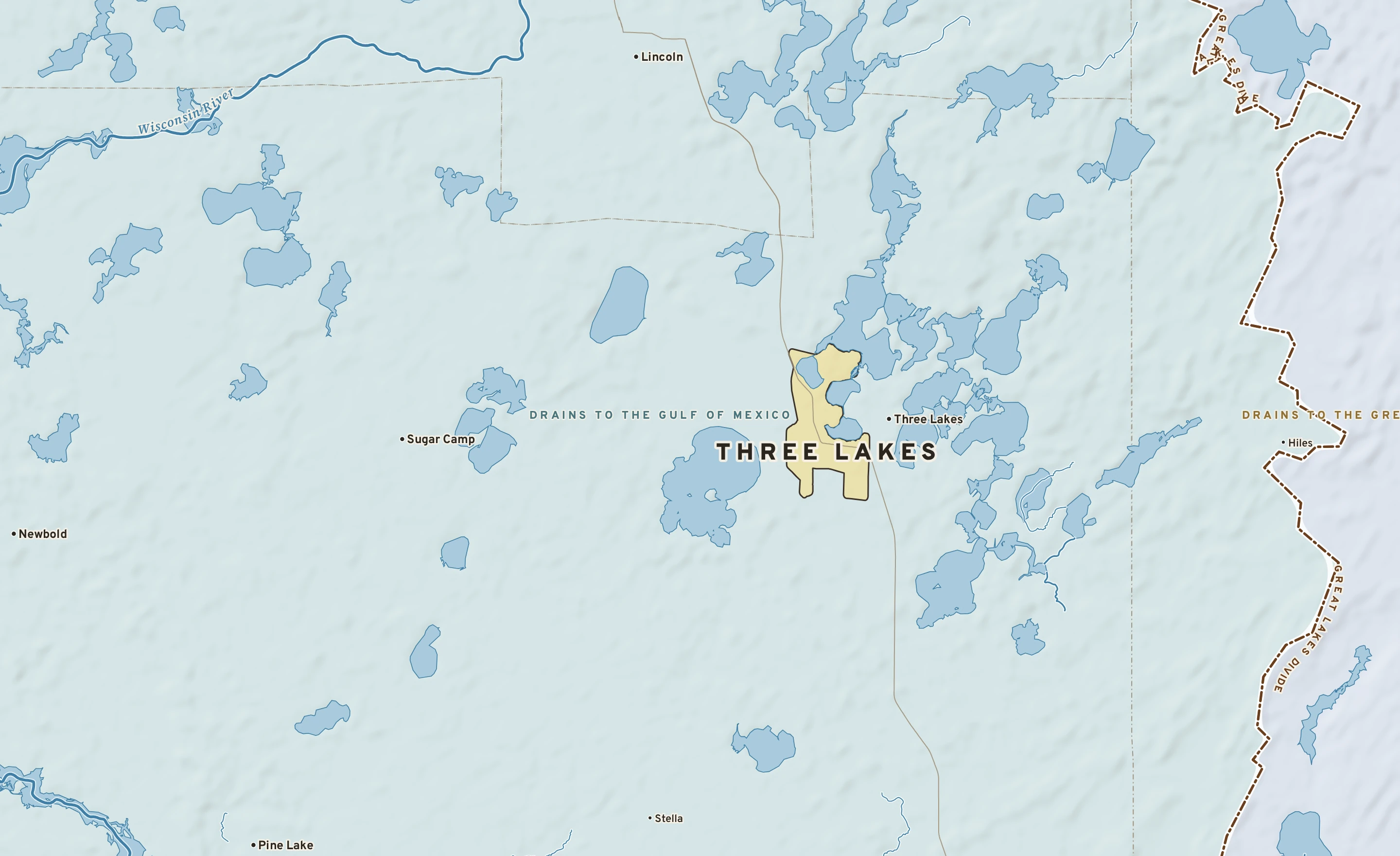 Shaded-relief atlas plate of Three Lakes, Wisconsin: rivers, roads, the city limits and where the water drains.