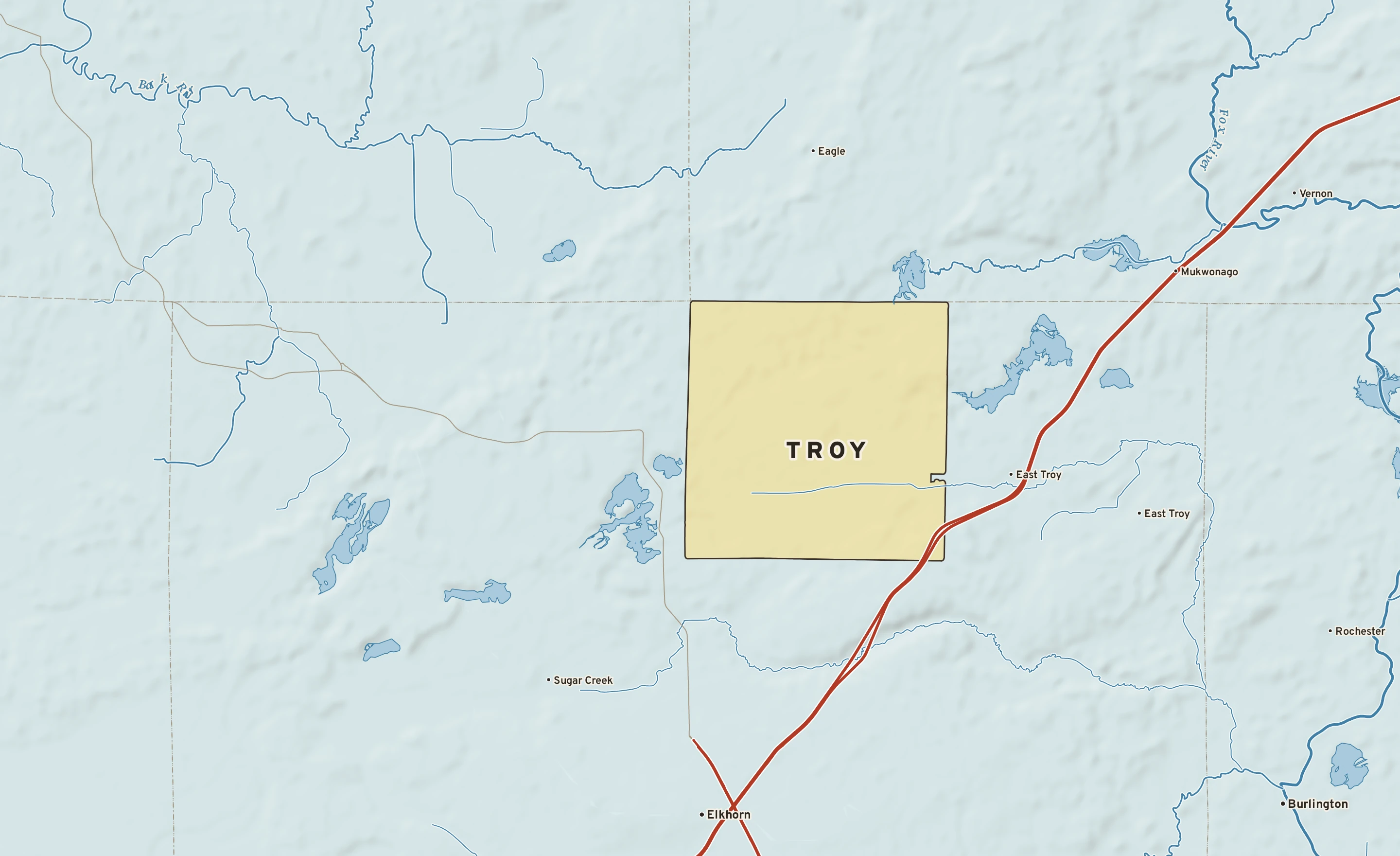 Shaded-relief atlas plate of Troy, Wisconsin: rivers, roads, the city limits and where the water drains.