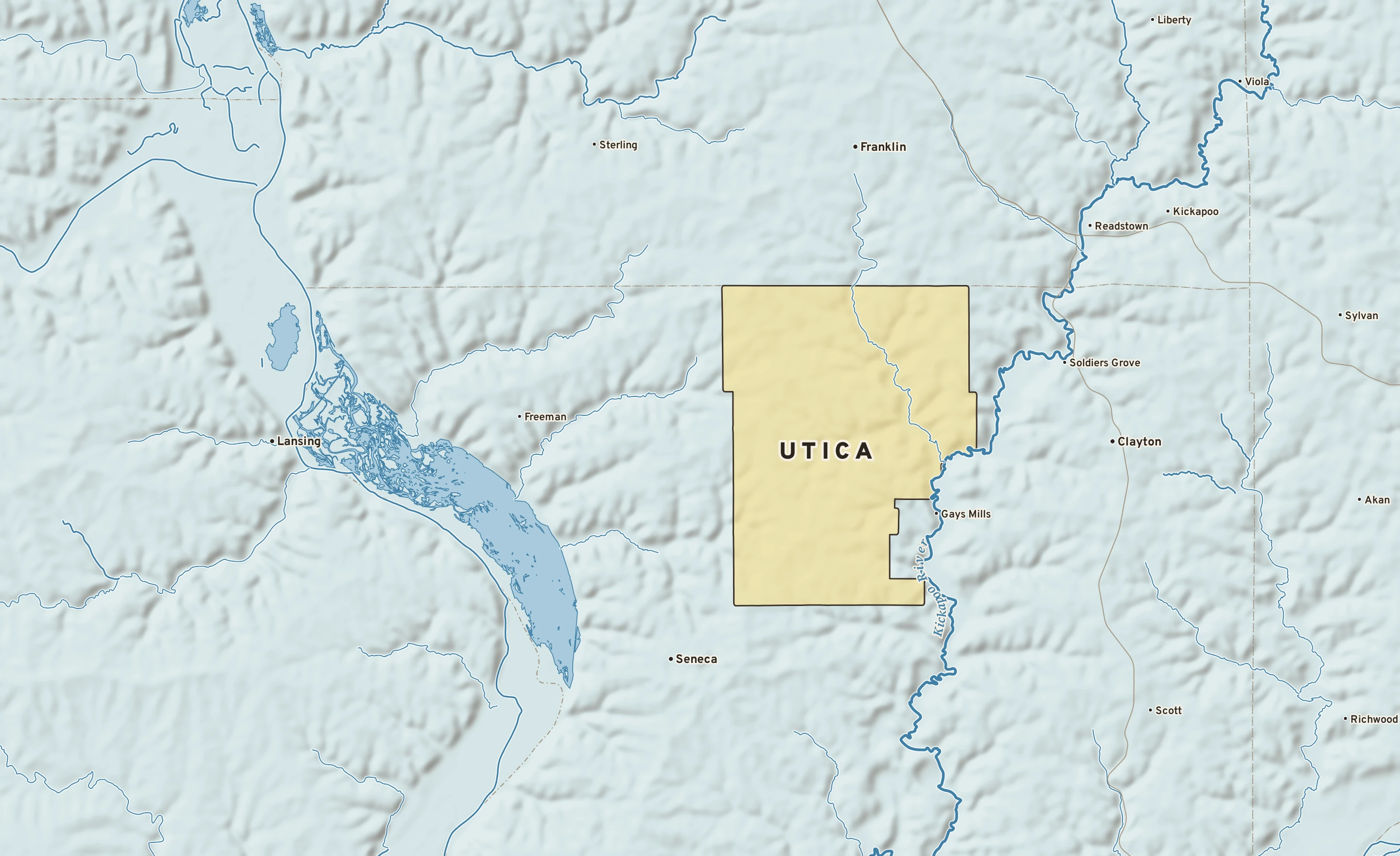 Shaded-relief atlas plate of Utica, Wisconsin: rivers, roads, the city limits and where the water drains.
