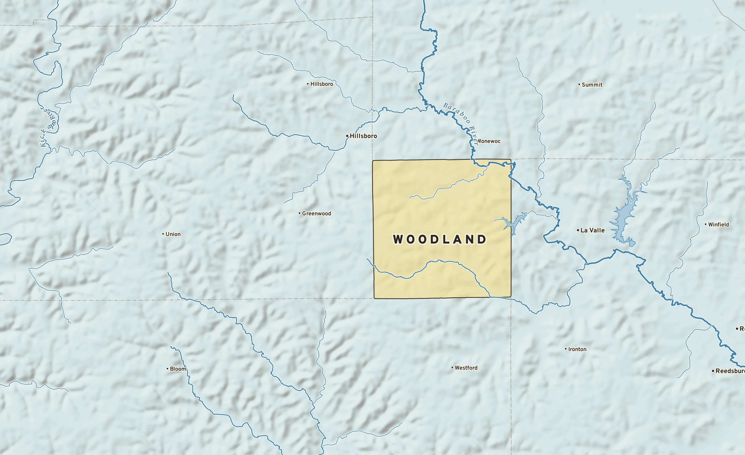 Shaded-relief atlas plate of Woodland, Wisconsin: rivers, roads, the city limits and where the water drains.