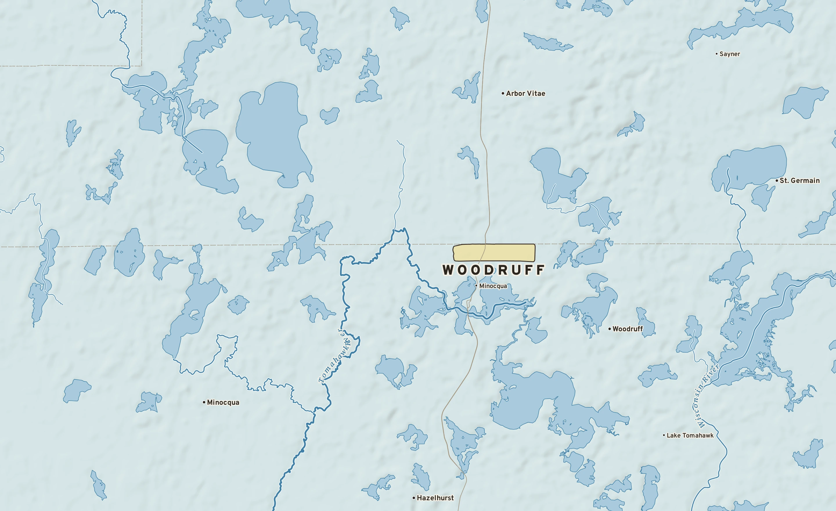 Shaded-relief atlas plate of Woodruff, Wisconsin: rivers, roads, the city limits and where the water drains.